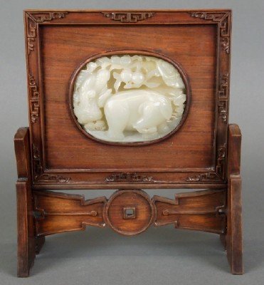 Chinese table screen: A small Chinese table screen with a carved Jade Medallion of a Scholar and an Elephant. Carved Rosewood frame and stand. Only minor wear. 9" high overall. ESTIMATE $800-1,200