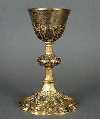 Communion Chalice: An Early 20th century Communion Chalice by "Fr Pustet & Co, France". Gold washed body with Silver detail and Apostle Medallions. Presented "To Rev Harry Imbus, From the Family, on his Ordination, May 