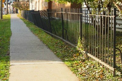 Wrought Iron fence: Turn of the century American wrought Iron fencing, Approx. 2000' available. Simple spike design with upper and lower flat rails and flat end posts. Each section is 90" long and 56" high. Old Black pai