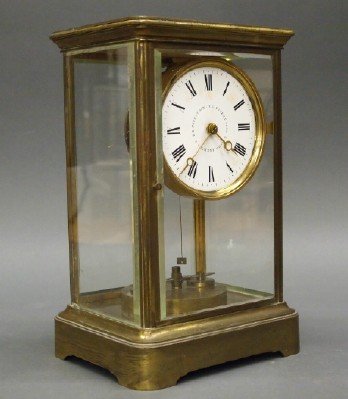 Anton Harder 400 day clock: A 19th century German Torsion pendulum clock by Anton Harder, c. 1883-1887. 400 day time only movement with rotary pendulum and enameled dial with black Roman numerals, in a brass case and beveled gla