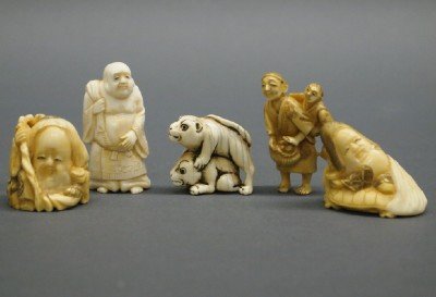 Japanese netsukes: Five Japanese ivory Netsukes. Various figural and animal motifs. Two are signed. Minor wear. Up to 2" high. ESTIMATE $200-400