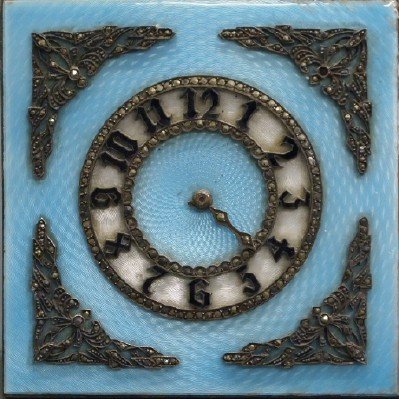 French enameled travel clock: An early 20th century French enamel travel clock. Blue enamel with guilloche work enhanced by marcasite. Gilt metal easel back. No apparent markings. Some wear and some losses to the marcasite. One of