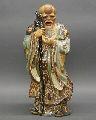 Vietnamese porcelain figure: Vietnamese porcelain figure of Jurojin. Depicted with flowing robes and holding a staff from which peaches are suspended. The underside is marked "Nov. 28, 1967 Dick and Kazuko Spraull Made in Viet-na