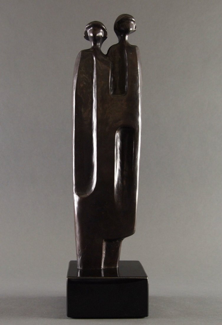 Dan Namingha Bronze: Dan Namingha, American, born 1950. A Bronze sculpture entitled "Two Sisters". Depicts two Native American girls standing with a blanket over their shoulders. Incised signature "Namingha" verso with ed