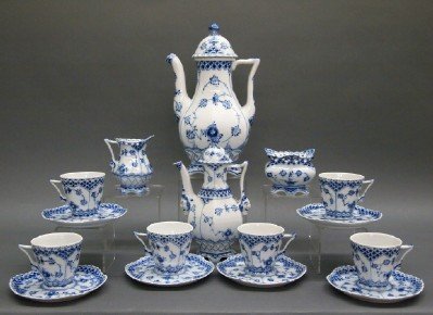 Royal Copenhagen Coffee Set: A Sixteen Piece Royal Copenhagen Porcelain Tea Set. In "Blue Fluted-Full Lace" pattern, the set includes Six flat cup and saucer sets with Gargoyles at the bases of the handles, One sugar bowl, One cr