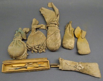 8 Native American Hide Paint Bags & Cases: A Group of Eight Native American Paint Bags & Cases. Including Six hide pouches that hold paint pigment, One cloth case with painting implements, and One box with painting implements and hairpipe piec