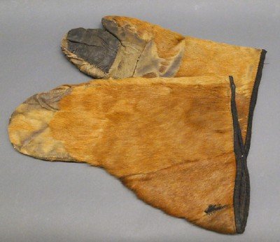 Native American Mittens: A Pair of 19th Century Native American Mittens. Most likely Bear skin. Very worn, shows age. 14 3/4" long. ESTIMATE $100-200