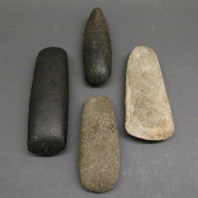 4 Stone Adzes & Celts: Four Native American Stone Adzes and Celts. Including Two adzes and Two Celts. Some wear to each. From 5 3/4" to 7" long. ESTIMATE $200-400