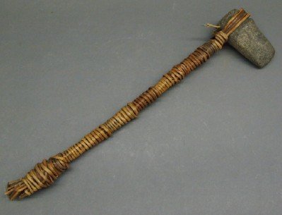 Native American Axe: A Pre-Historic Native American Three Quarter Groove Axe. Ancient Stone axe head is married with a Wrapped reed handle of a later date. No apparent markings. Age apparent, some breakage to the handle.