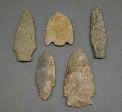 5 Spear Heads: Five Native American Spear Heads. Each of carved Flint and of various sizes and shapes. Wear to each. From 3" to 4 1/2" long. ESTIMATE $100-150