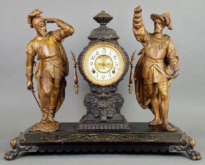 Ansonia "Pizarro & Cortes" Clock: A Late 19th Century Ansonia "Pizarro and Cortes" Figural Mantle Clock. Eight day time and strike, with open escapement and Porcelain enameled dial. Cast metal case and Double figures, depicting Pizarr