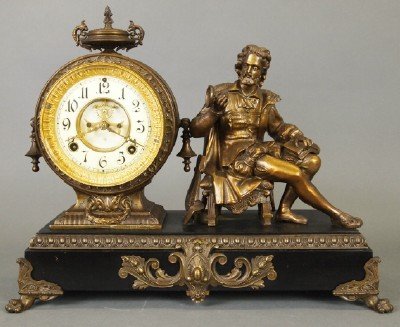 Ansonia "Arion" Clock: A Late 19th Century Ansonia "Arion" Figural Mantle Clock. Eight day time and strike movement with open escapement and enameled Porcelain dial. Cast patinated metal case and Figure, situated on an Ebon