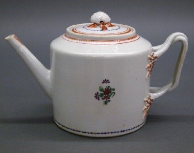 Chinese Export Teapot: A Late 18th/Early 19th Century Chinese Export Porcelain Teapot. With berry and leaf form finial, painted floral Sprays, and applied Twisted handles that are accented by molded Berry and Leaf designs. 
