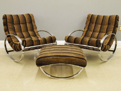 1970's Italian Rockers and Ottoman: A pair of 1970s Italian Chrome "Ellipse" Rocking Chairs and Matching Ottoman, Designed by Ronato Zevi and Imported by Selig. The chairs with curvilinear seat structures and oval side panels which form