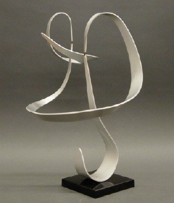 John Anderson Kinetic Sculpture: John W. Anderson, American, 20th Century. Abstract pieces of aluminum are bent, almost to create a ribbon-like shape, and delicately balance on one another allowing for subtle movement. On a black pla