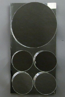 Pr of John Leslie Mirrors: A Pair of Mirrored Wall Sculptures by John Leslie. Each is of rectangular form and contains raised circular and rectangular mirrored shapes. Both monogramed "JL" at the lower right corner and include 