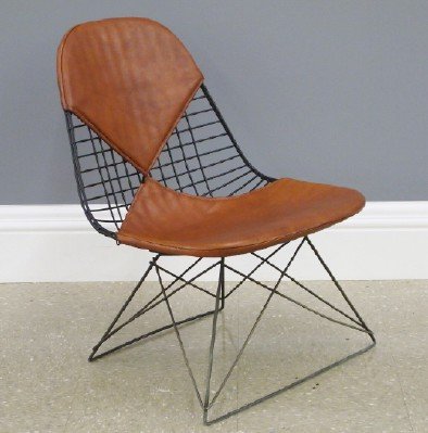 Eames LKR Chair: A Mid Century Modern LKR Chair Designed by Charles and Ray Eames for Herman Miller. Enameled steel and steel frame with cat's cradle base, brown Naugahyde at the back and seat. Includes paper label th