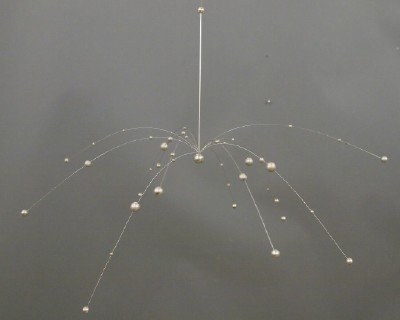 Laurids Lonborg Atomic Mobile: A Danish Mid Century Modern Mobile Designed by Laurids Lonborg. Consisting of Stainless Steel spheres of various sizes strung on thin metal wires that radiate from a central Sphere, creating an Atomic