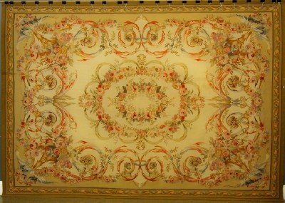 Aubusson rug: An 8.6 x 12.2' Turn of the Century French Aubusson Carpet. Consisting of traditional Aubusson coloration and floral design, accented by a Central medallion on a floral field. Minor wear. ESTIMATE $2,0