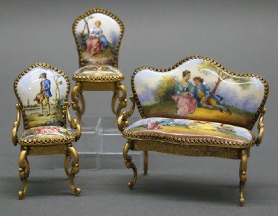 Austrian Mini Chairs & Settee: A Turn of the Century Austrian Miniature Parlor Set. Consisting of an armchair, a side chair, and a Settee. Each with gilt ormolu frame and enamel decoration, with courting scene motif, at the back an