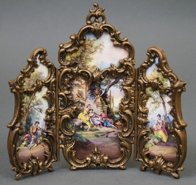 Austrian Miniature Screen: A Turn of the Century Austrian Miniature Screen. Having an Ormolu frame with Three inset enameled panels, forming one continuous Courting Scene. Stamped "Austria". Minor wear. 5 3/4" x 5" high. ESTIMA