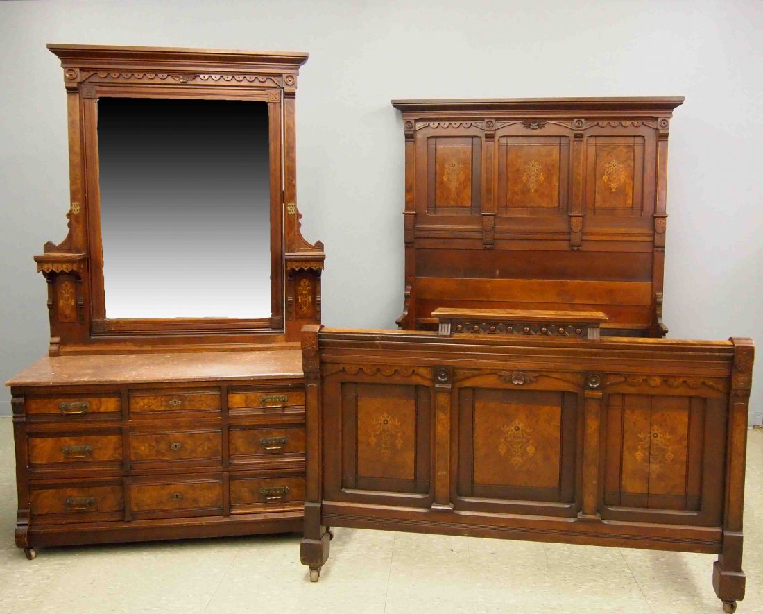 2 pc Victorian Bedroom Set: A 19th century American Victorian Period Walnut bedroom set. Transitional Eastlake style with carved detail, burl panels and fine inlaid floral decoration. Includes a Marble top dresser (80”high) wi