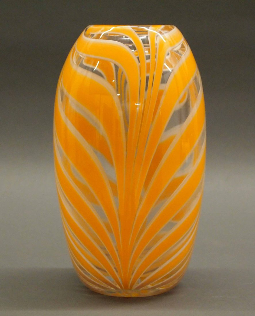 Murano Glass Vase: A Mid-Century Murano Glass Vase. Heavy glass clear vase with white and orange "Fenicio" motif. Unmarked, but Cenedese or Venini quality; with polished pontil. Minor wear. 9 1/2" high. ESTIMATE $200-30