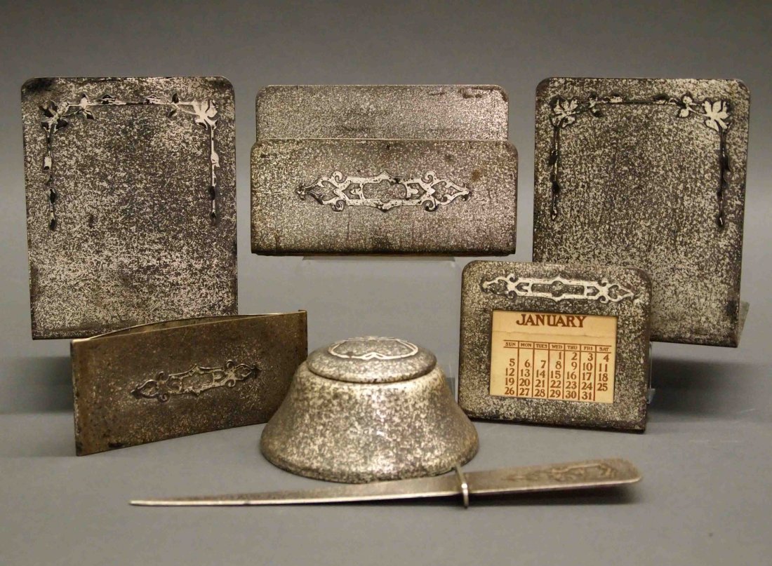 Silver Crest 7 pc Sterling/Bronze Desk Set: An Arts and Crafts Silver Crest Desk Set. Sterling over Bronze Six piece desk set, of two patterns, consists of a letter opener, a letter holder, a calendar, a blotter and bookends; also included is O