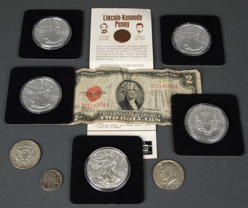 9 American coins & $2 Bill: Nine American Coins and a $2 Bill. Including Five .999 Pure Silver 2014 Walking Liberty Coins, Two Half Dollars (1968 & 1969), a Buffalo Nickle, a Lincoln-Kennedy Penny, and a $2 Bill. Each Walking Li