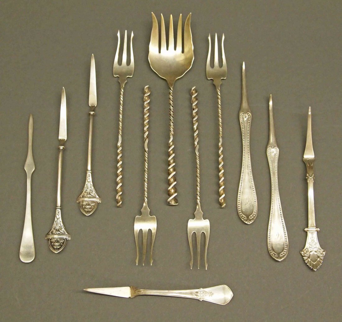 12 pcs of Sterling Flatware: Twelve Pieces of American Sterling Flatware. Including Four cocktail forks and One sardine fork in the "Square Twist" pattern by Whiting; One Watson and Two other Sterling nut picks; and Four nut pick