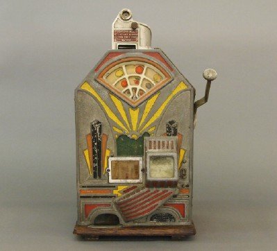 Jennings Little Duke Slot Machine: A early 1930's "Jennings Little Duke" 1 cent slot machine, stamped 228402 on the outer edge of the face plate. Worked when cataloged, partial paper label on the interior of the back door, lacks door k