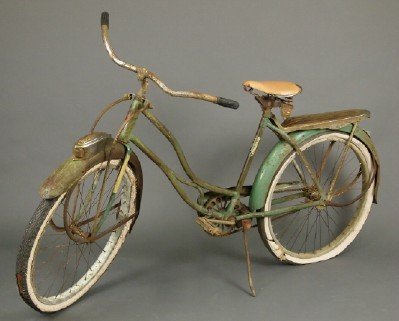 Shelby Flying Cloud Girls Bicycle: A "Shelby Flying Cloud" girls bicycle. Original paint, head badge and headlight. Double spring seat. Heavy pitting to the chrome, bent handlebar and replaced seat, denting on front and rear fenders, t