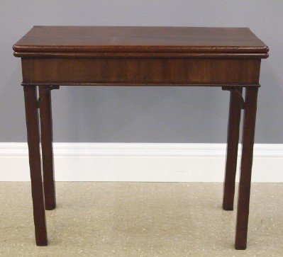 George III games table: A late 18th century George III Period Mahogany flip-top games table. Folding Cuban Mahogany top above a skirt with single dovetailed cards drawer on bracketed, molded Marlborough legs (one swings to s