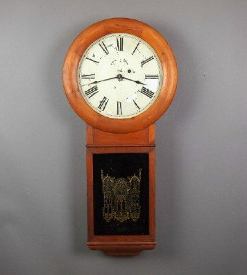 Seth Thomas #2 Regulator: A late 19th century Seth Thomas #2 Regulator wall clock. 8-day time only weight driven movement with seconds bit and painted metal. Cherry case with circular upper door and molded rectangular lower. O