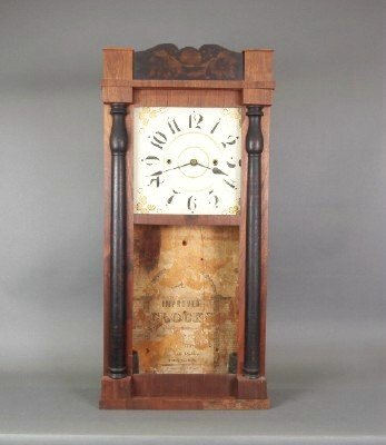 Lawyer Byington shelf clock: A 19th century Lawyer Byington (Newark Valley, NY) shelf clock. 30 hr time and strike weight driven wooden movement with painted wooden dial. Mahogany case with shaped stenciled crown above a single d