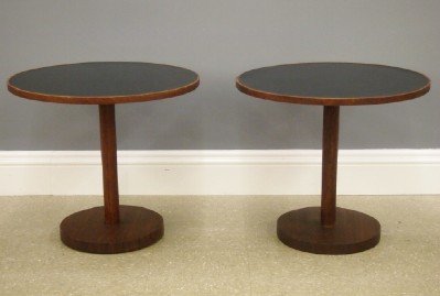 Pr Danish Modern end tables: A pair of 1950's Danish Modern Teak end tables. Circular Black Formica tops with Teak rims and bases. Original finish with some wear, one with repair to wood rim. Each 24" diameter x 21" high. ESTIMAT