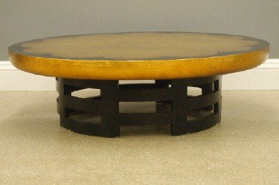 Lotus Gold Leaf cocktail table: A Kittinger "Lotus" Gold leaf cocktail table designed by designed by Theodore Muller and Isabel Barringer. Lobed Gold Leaf top with Ebonized border and Gold rim in a Asian inspired fretwork base with
