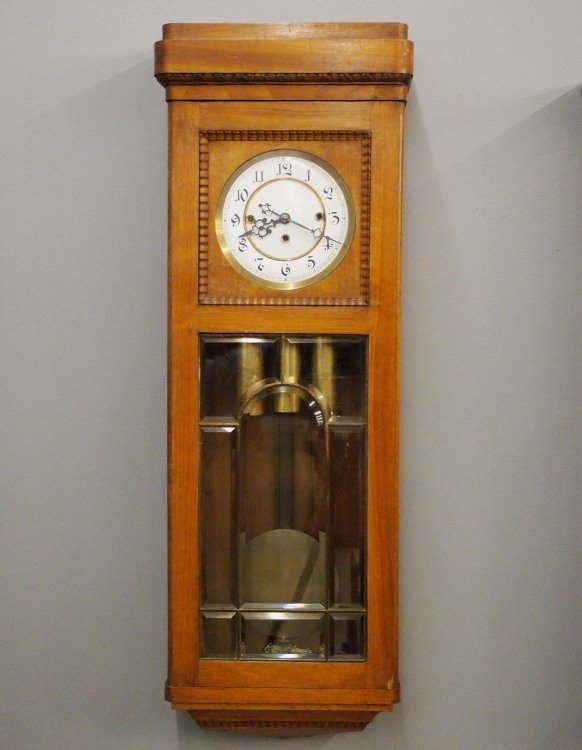 3 wt Vienna Regulator: A late 19th century Vienna Regulator wall clock by Gustav Becker. Three weight movement with quarter hour strike and two part porcelain dial. Fruitwood case with leaded and beveled glass lower door. R