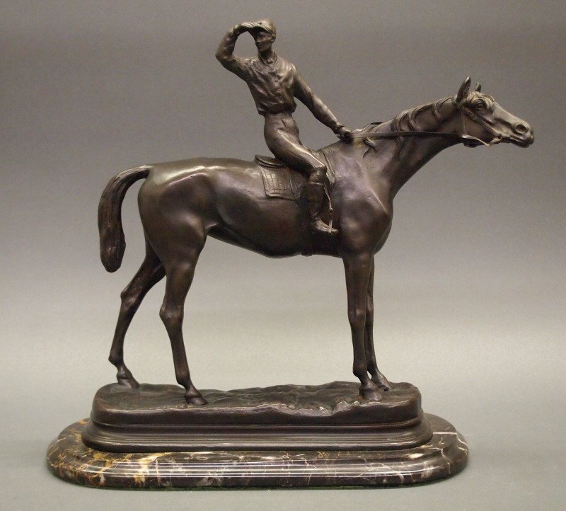 After Mene bronze sculpture: After Pierre Jules Mene, French, 1810-1879. Bronze sculpture modeled as a jockey astride a racehorse. Inscribed "P. J. Mene", having a medium brown patina. Some discoloration noted under the front hoo