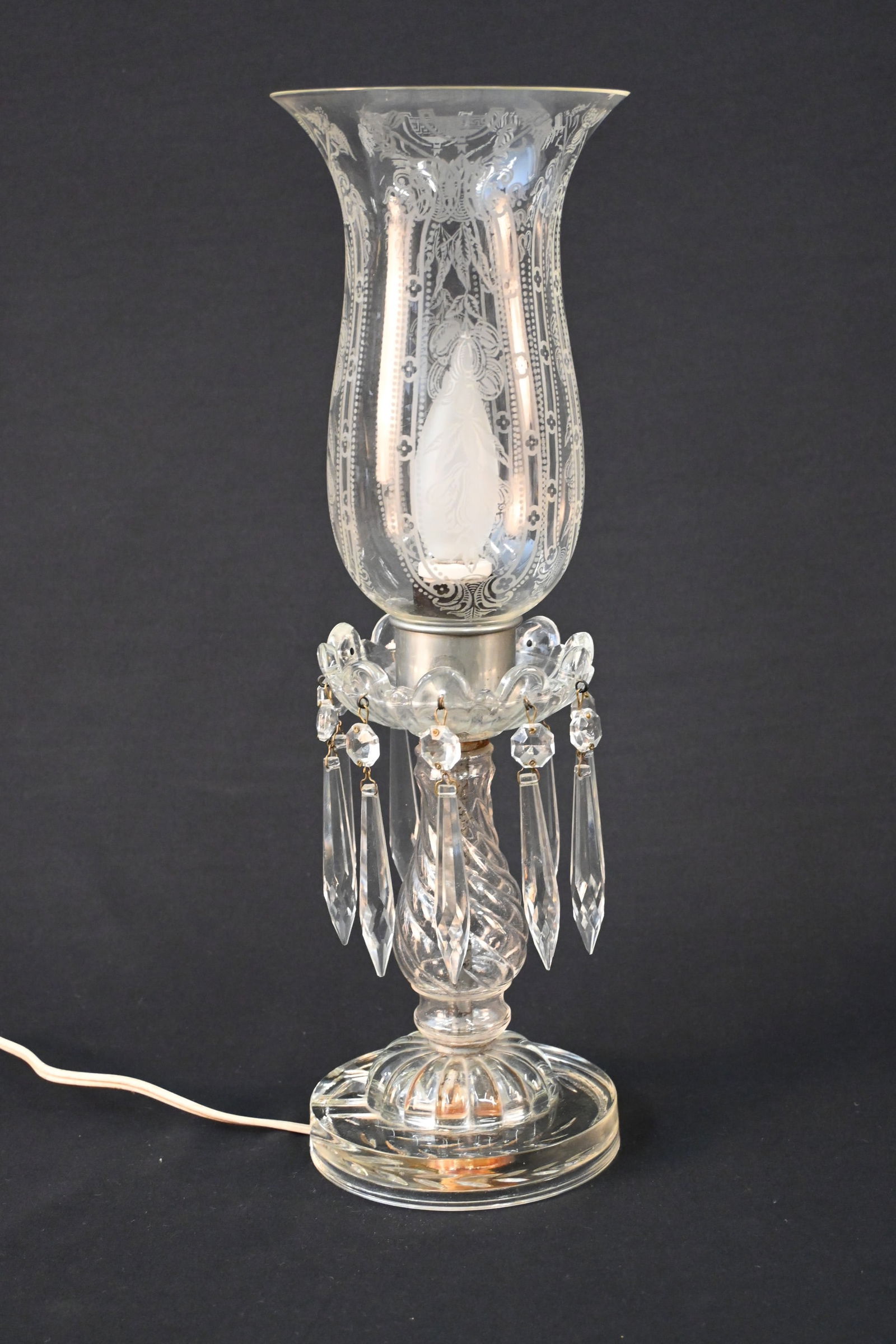 Vintage Electric Glass Hurricane Shade Boudoir Lamps With Crystal Prisms: This gorgeous set of vintage boudoir lamps, featuring etched hurricane shades and sparkling crystal prisms, was sourced from a refined estate sale and exudes timeless charm.Each lamp showcases a class