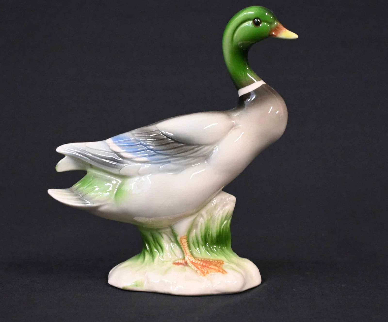Vintage Hand-Painted Porcelain Mallard Duck Figurine: Up for auction is a beautifully crafted vintage porcelain figurine of a mallard duck, expertly hand-painted with lifelike detail. The duck features a glossy finish, a vibrant green head, and realistic