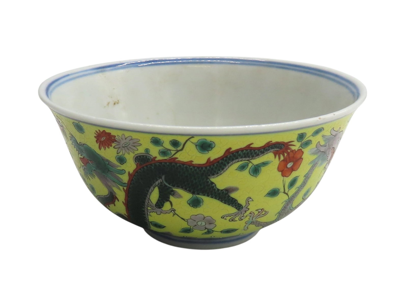 A YELLOW-GROUND SGRAFFIATO DRAGON BOWL QING DYNASTY, 19TH CENTURY the interior painted with a: A YELLOW-GROUND SGRAFFIATO DRAGON BOWL QING DYNASTY, 19TH CENTURY the interior painted with a further iron-red dragon medallion, with an apocryphal Qianlong seal mark 15.5cm diam PROVENANCE: From the