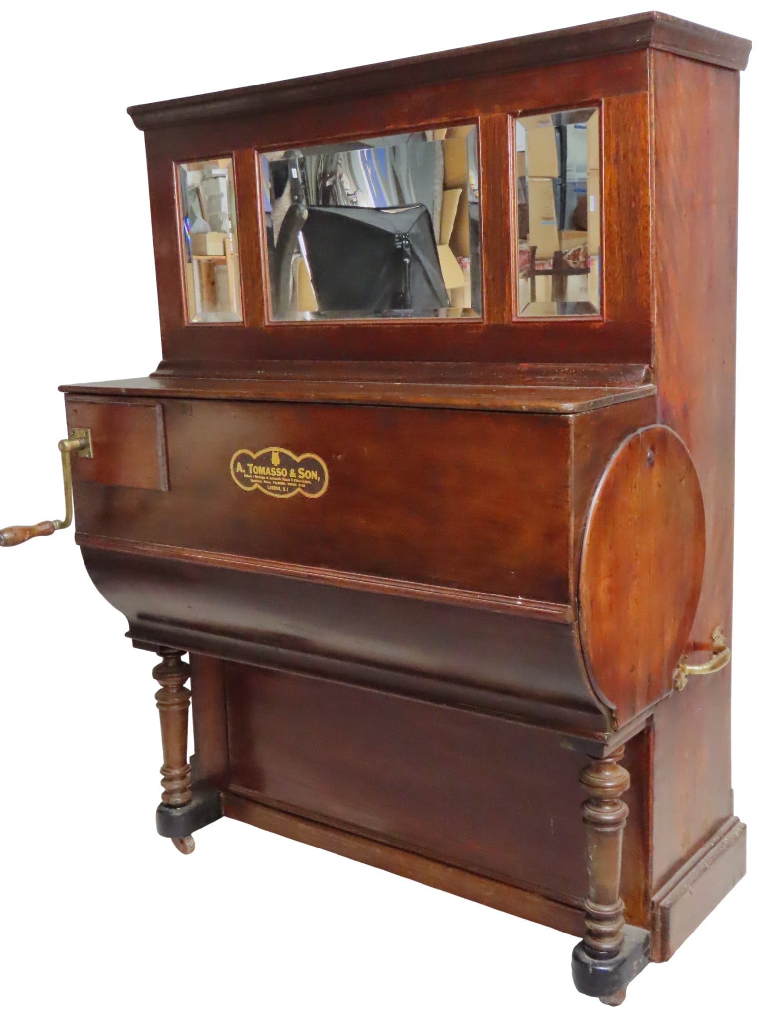 A TOMASO & SONS HAND CRANK BARREL PIANO the case inset with three bevelled mirror plates with: A TOMASO & SONS HAND CRANK BARREL PIANO the case inset with three bevelled mirror plates with maker's label affixed to the lid 142 x 104 x 58 cm Provenance: Contents of The Manor House, Templecombe
