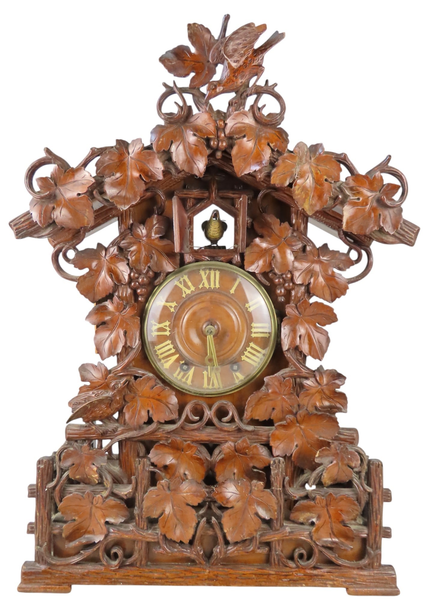 A FINE BLACK FOREST DOUBLE FUSEE CUCKOO CLOCK LATE 19TH CENTURY 14.5 cm dial in a chalet form case: A FINE BLACK FOREST DOUBLE FUSEE CUCKOO CLOCK LATE 19TH CENTURY 14.5 cm dial in a chalet form case with carved vine leaf decoration 63 cm high