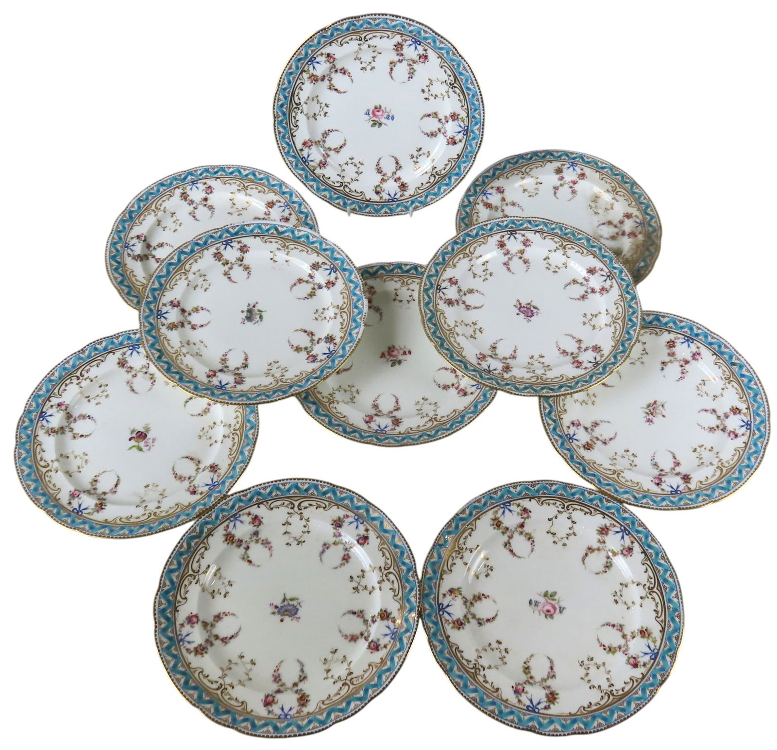 A GROUP OF TEN COALPORT FELDSPAR DINNER PLATES 19TH CENTURY hand painted ribbon tied festoon: A GROUP OF TEN COALPORT FELDSPAR DINNER PLATES 19TH CENTURY hand painted ribbon tied festoon decoration, within a striking turquoise and gilt border, underglaze marks to the underside 25 cm diam