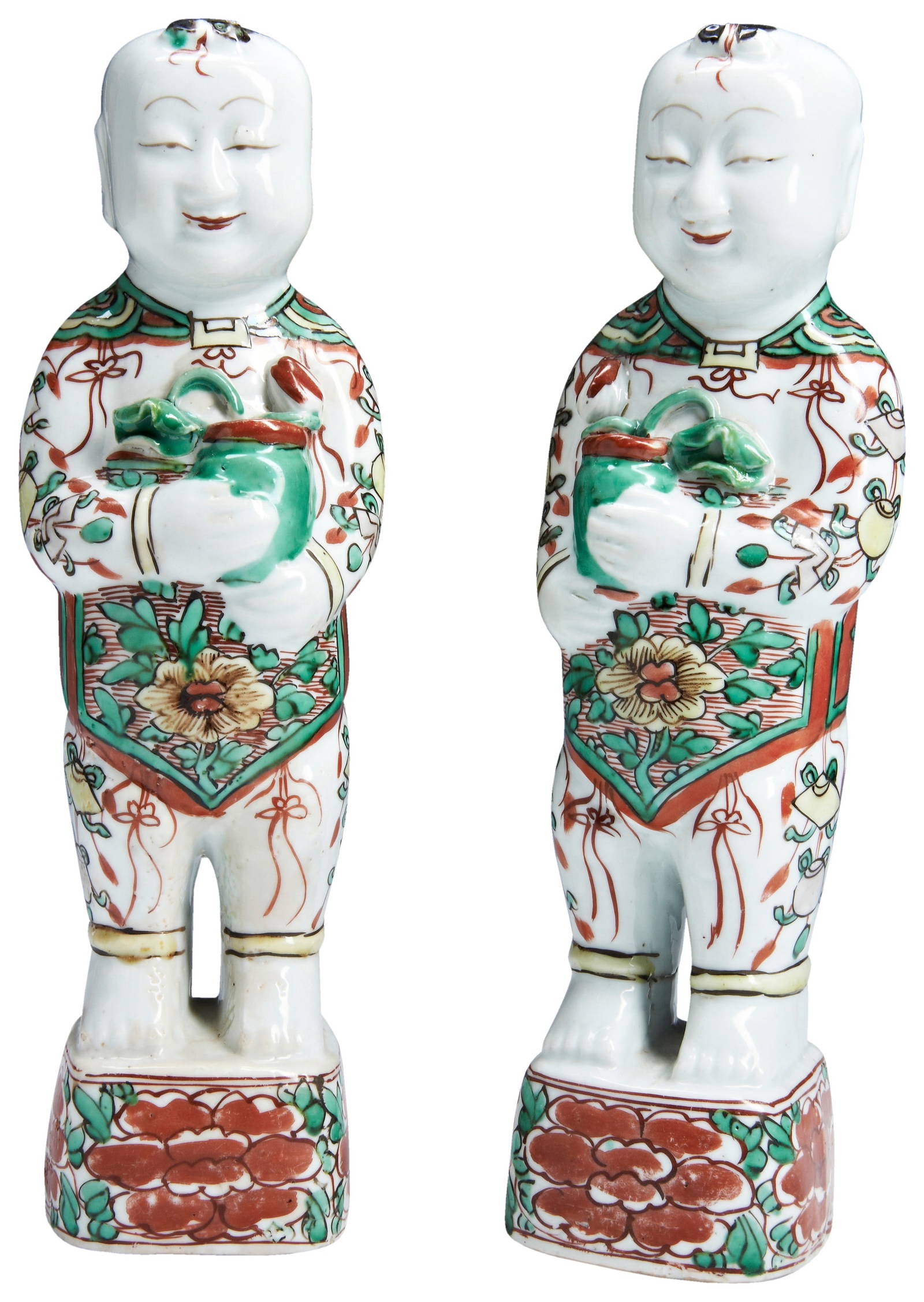 A PAIR OF CHINESE PORCELAIN WUCAI STANDING FIGURES OF SMILING BOYS, HEHE, SHUNZHI, CIRCA 1650.