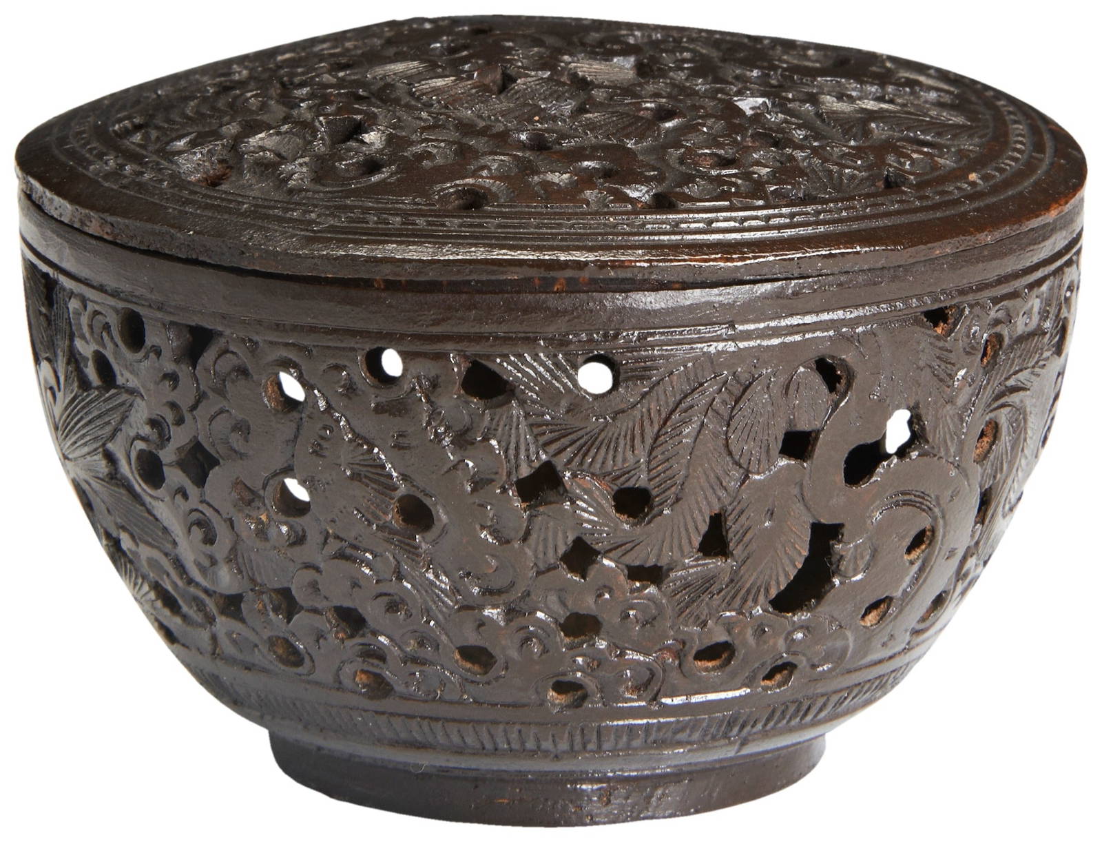 A CARVED COCONUT CRICKET CAGE LATE QING DYNASTY carved and pierced throughout with meandering leafy