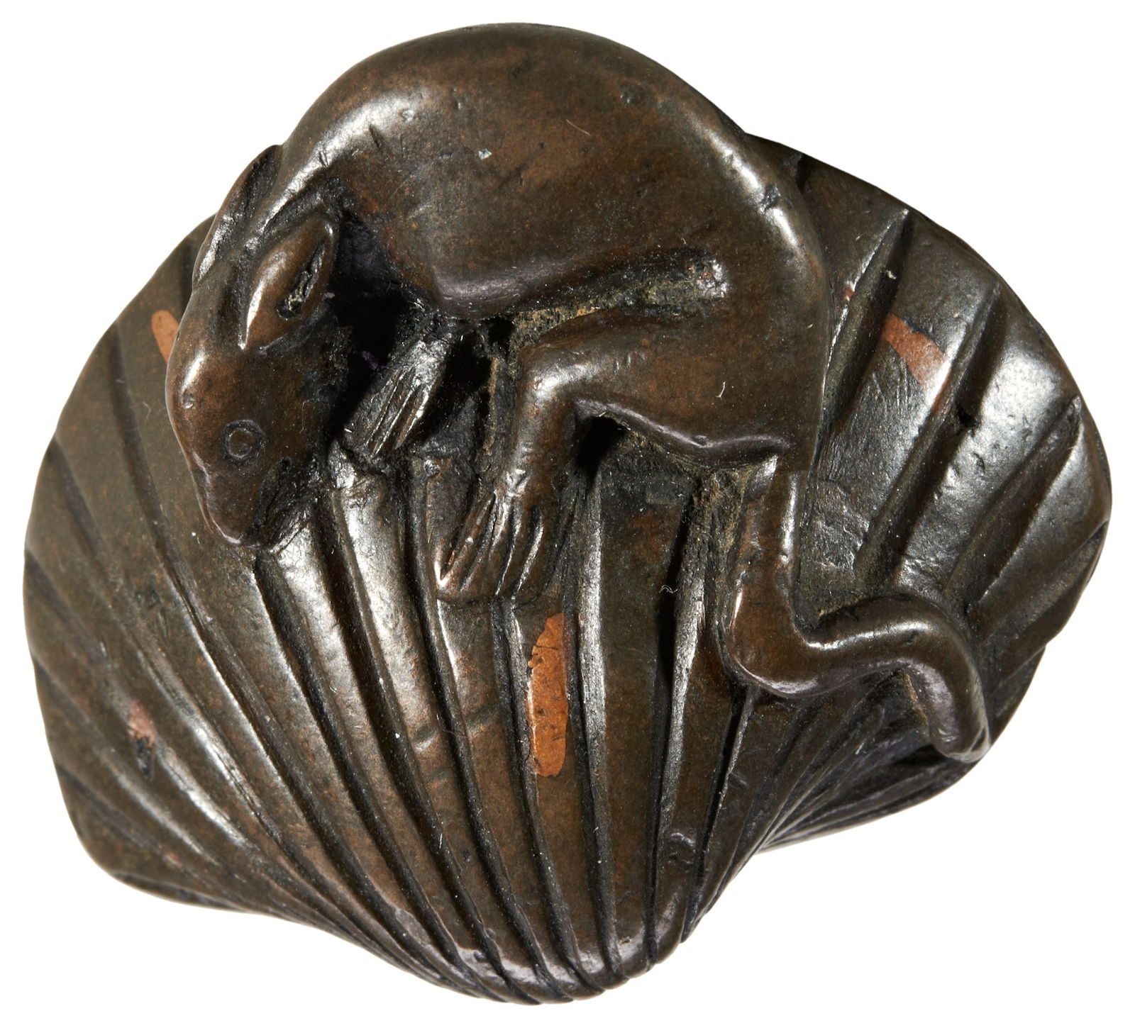 A JAPANESE BRONZE NETSUKE 20TH CENTURY modelled as a rat on a clam shell 4.0cm wide PROVENANCE:: A JAPANESE BRONZE NETSUKE 20TH CENTURY modelled as a rat on a clam shell 4.0cm wide PROVENANCE: From the Eva & Aubrey Sweet Collection, Melbourne, Australia. Acquired from McLelland, Melbourne, Austra