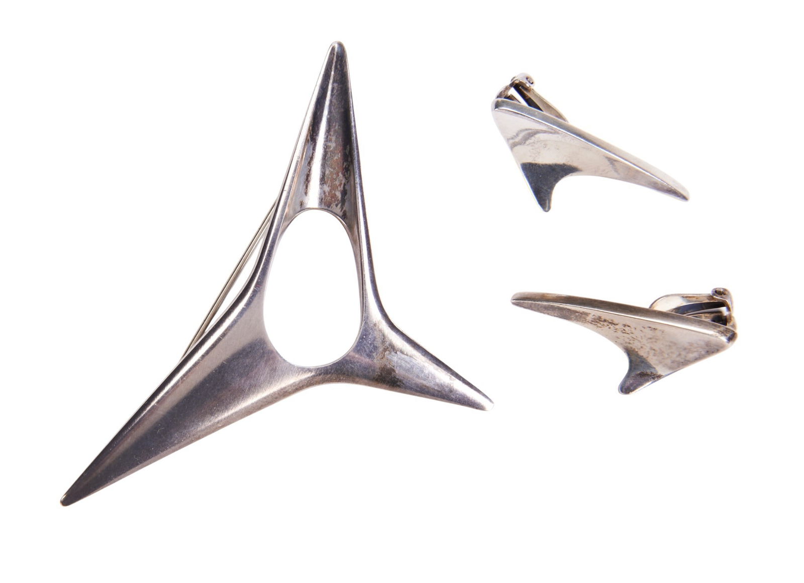 GEORG JENSEN, A SILVER BROOCH, No.342, DESIGNED BY HENNING KOPPEL, designed as a polished abstract: GEORG JENSEN, A SILVER BROOCH, No.342, DESIGNED BY HENNING KOPPEL, designed as a polished abstract form with three points. Signed Georg Jensen Stamped Sterling and HK 15.2gms Numbered 342 7.7cm wide&#