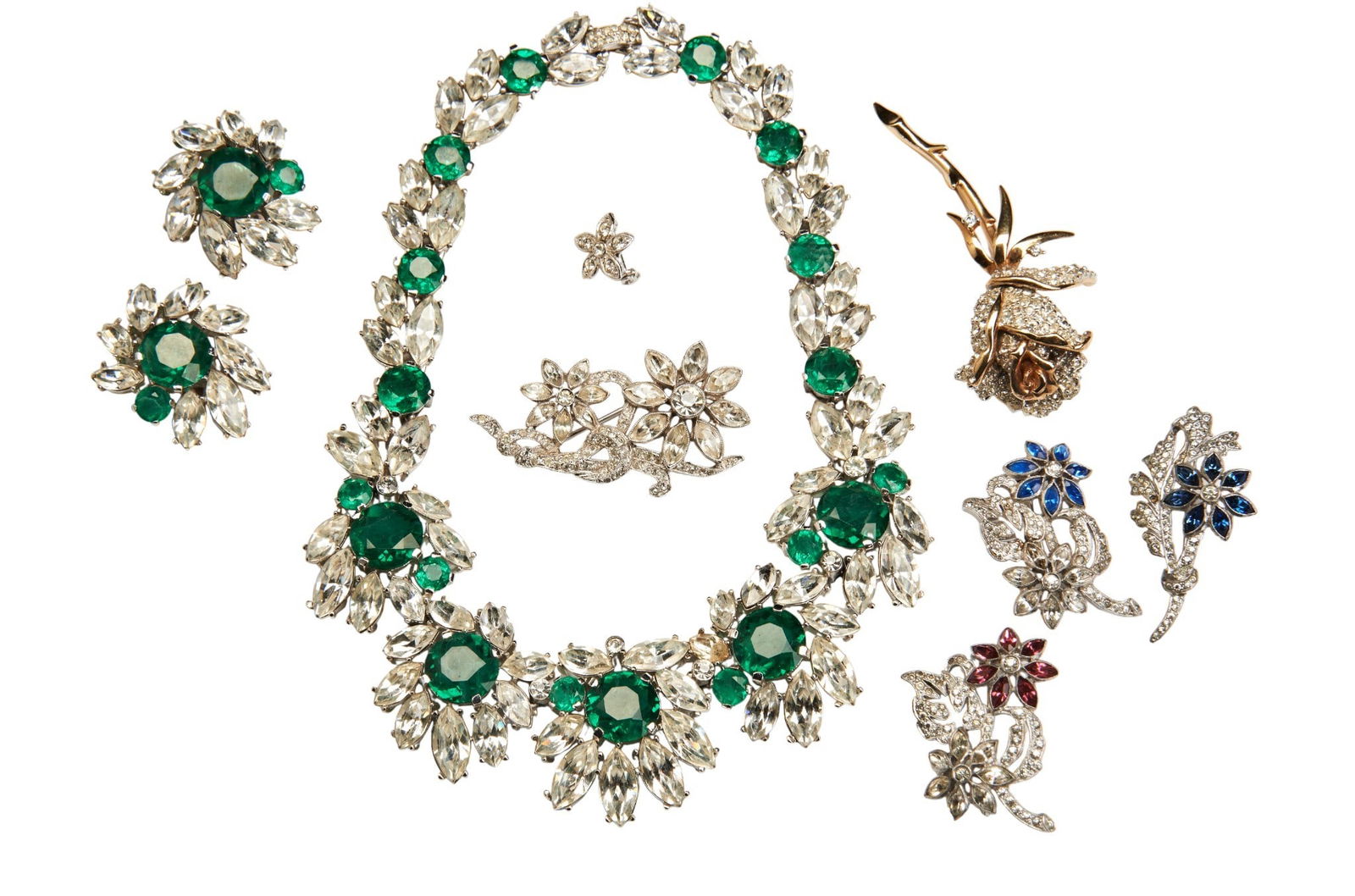 TRIFARI, A 1960's SYNTHETIC EMERALD AND WHITE PASTE NECKLACE, the circular cut synthetic emeralds: TRIFARI, A 1960's SYNTHETIC EMERALD AND WHITE PASTE NECKLACE, the circular cut synthetic emeralds with surrounds of marquise cut and circular cut white paste. Stamped TRIFARI 10.5cm inner width Togeth